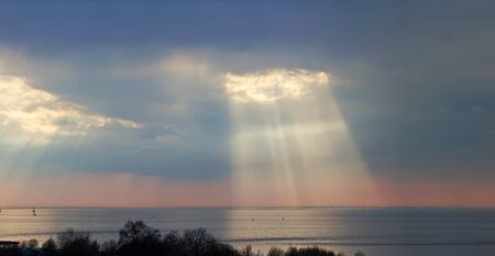 sunshine before a decline over the seaの写真素材