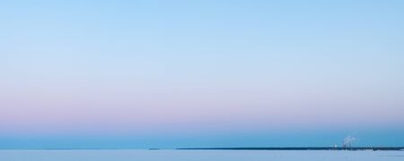 turning pink sky at dawn in winterの写真素材