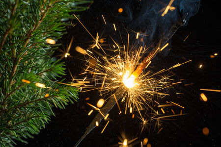 Christmas still life - sparklers and spruce branchesの写真素材