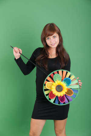 girl with artificial flower on a green の写真素材
