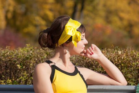 The young woman in park on a benchの写真素材