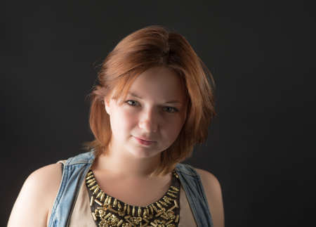portrait of a beautiful girl on a black backgroundの写真素材