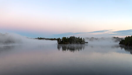 Morning landscape on the lake with fog, panoramaの写真素材