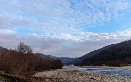 evening landscape in the bed of a mountain riverの写真素材