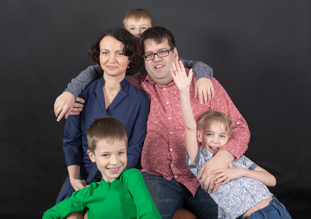 Portrait of a family with three boys