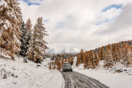car on a mountain road in the winterの写真素材