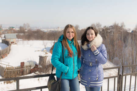 Two teenage girls outdoors in winter dayの写真素材