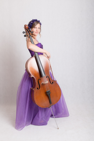 girl in evening dress with celloの写真素材