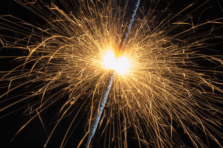 burning fire with lots of sparks closeupの写真素材