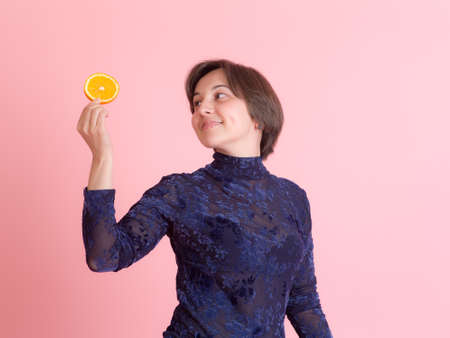 portrait of a woman with an orange