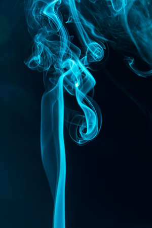 blue smoke on a black background closeupの写真素材