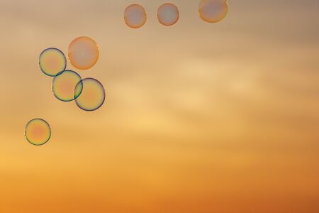 lot of bubbles on the background of sunset sky