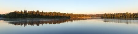 Morning landscape with reflections on the lake, panoramaの写真素材