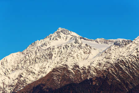 peaks of the Caucasus Mountains in sunny dayの写真素材