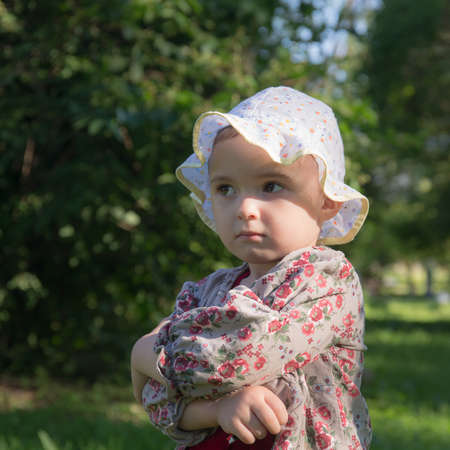 portrait of a pensive little girl in summerの写真素材