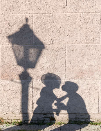the shadow of the couple on the wall