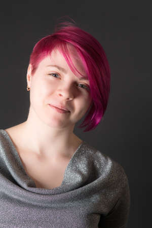 studio portrait of a girl with crimson hair
