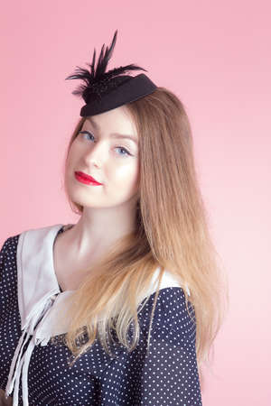 portrait of a girl in a dress and hatの写真素材