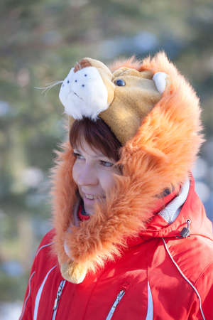 Portrait of a cheerful girl in winter clothes