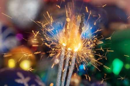 sparks on the background of Christmas toys