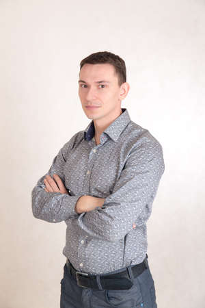 portrait of a man in a gray shirt