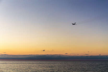 plane flies over the sea from the airport in Adler, Sochiの写真素材