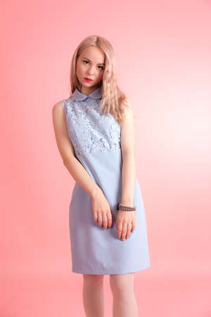 Slim sensual girl on a pink backgroundの写真素材