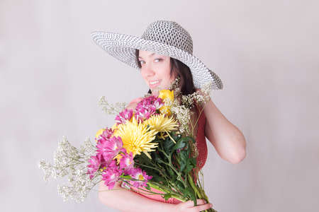 Portrait of a girl with a bouquet of flowersの写真素材