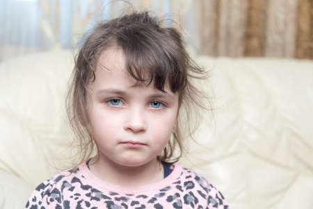 Portrait of a sad little girl closeupの写真素材