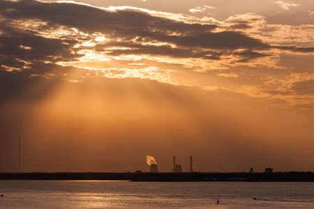 Dramatic summer sunset with clouds over the bay
