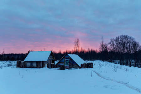 Early morning in the village in winterの写真素材