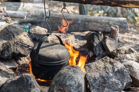 pot on a fire in a stone hearth