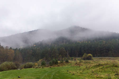 Landscape with morning mist in the mountainsの写真素材