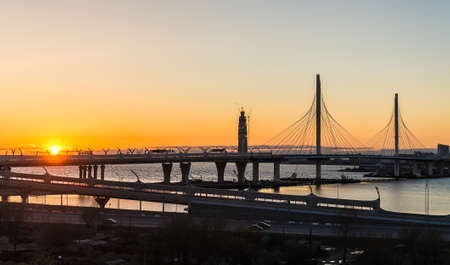New bridge and skyscraper under construction at sunsetの写真素材