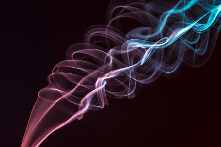 Abstract colored smoke on a black backgroundの写真素材