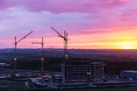 Construction site in the evening during a bright sunsetの写真素材
