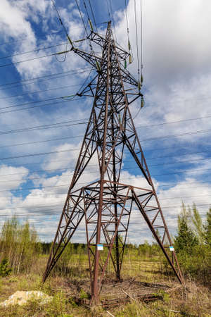 Tower of power lines in the forestの写真素材