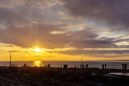 View of the construction site on the beach at sunsetの写真素材