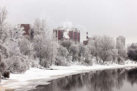 city winter landscape with a river in the foregroundの写真素材