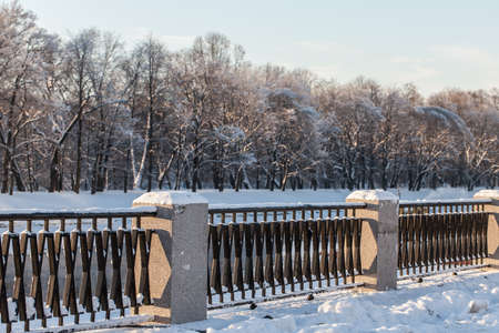 fence near a river in a winter parkの写真素材