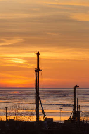 construction site on the beach at sunsetの写真素材