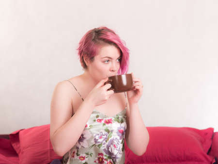 girl in bed with traditional morning coffeeの写真素材