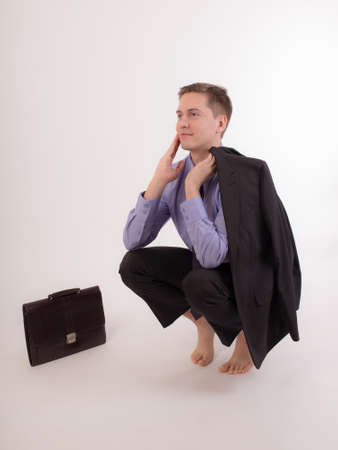 man after work relaxes in a yoga poseの写真素材