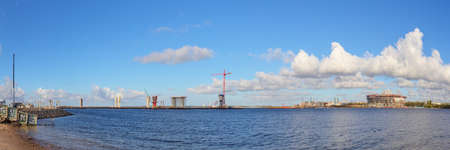 Construction site of a new bridge across the bay and the stadiumの写真素材