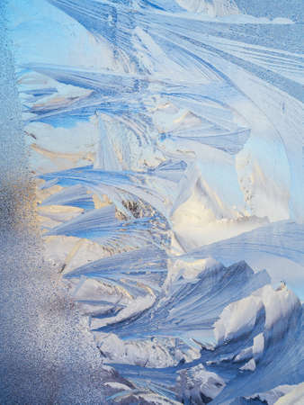 abstract frost texture on a glass window in winter