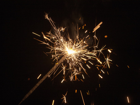sparks of burning pyrotechnics on a black background