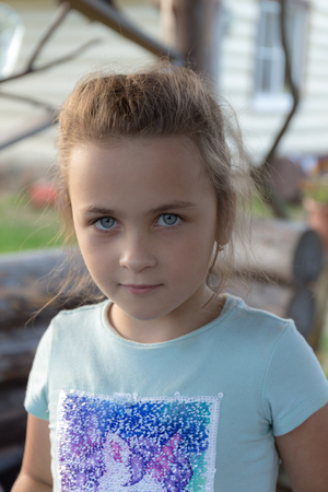 portrait of a little girl with blue eyes closeupの写真素材
