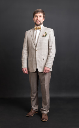 portrait of a man in a suit with a bow tieの写真素材