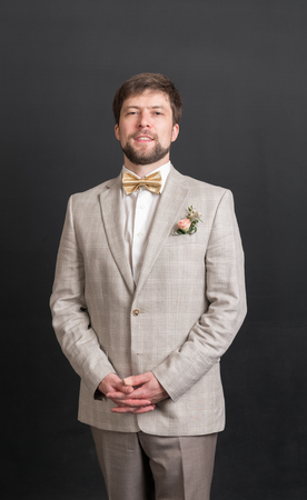 portrait of a man in a suit with a bow tieの写真素材
