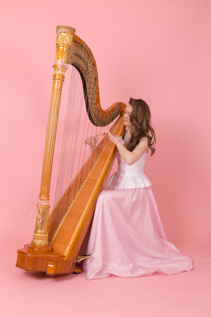 portrait of a girl playing the harp
